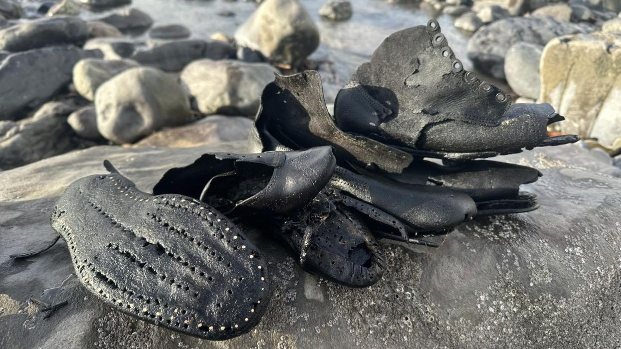 Mystery as dozens of Victorian shoes wash up on British beach