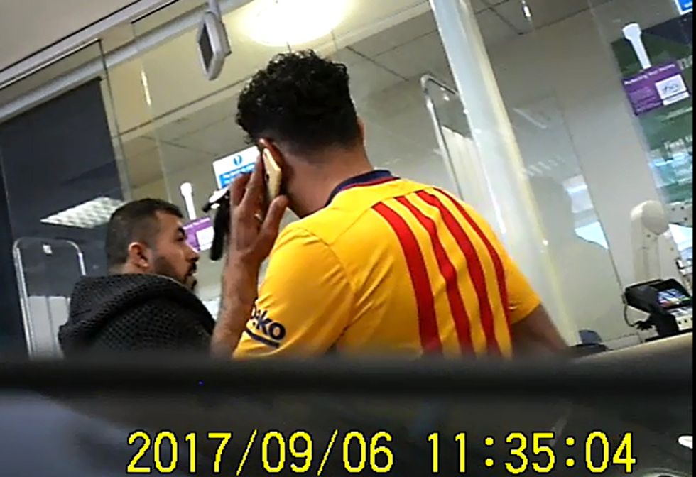 Namik and Ahmed in a bank in Oldham