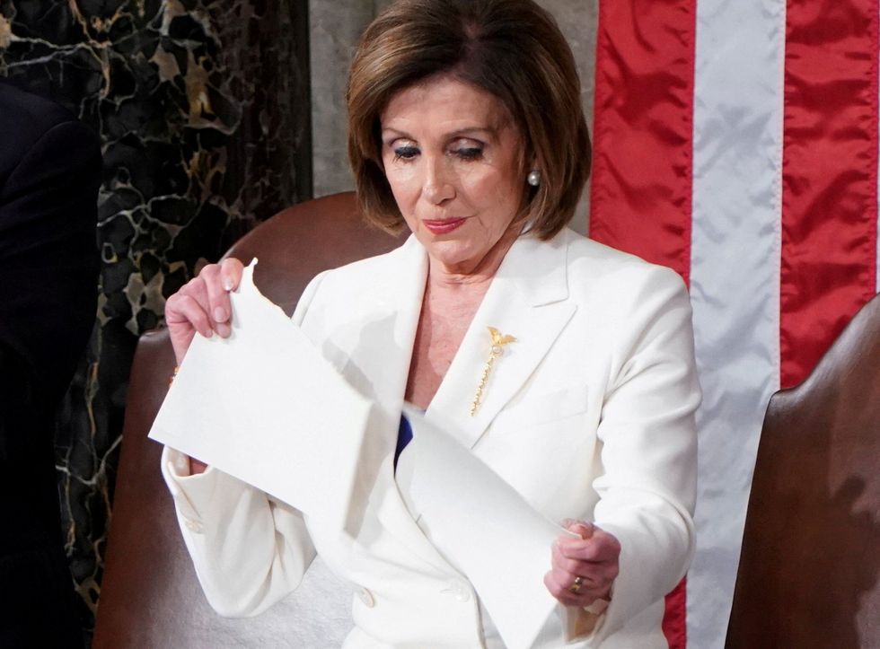 Nancy Pelosi ripping up a copy of Donald Trump's speech in 2020