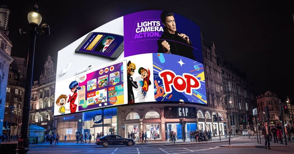 Narrative Entertainment TV advertisements on top of stores on street corner
