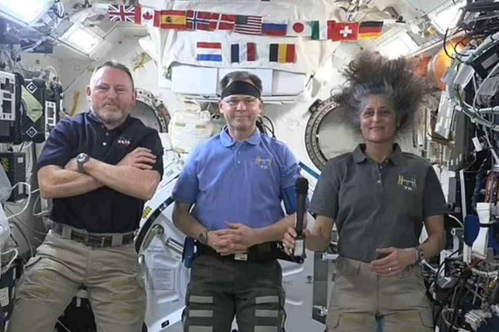 Nasa astronauts Barry Wilmore (left), Sunita Williams (right) and Nick Hague (center)