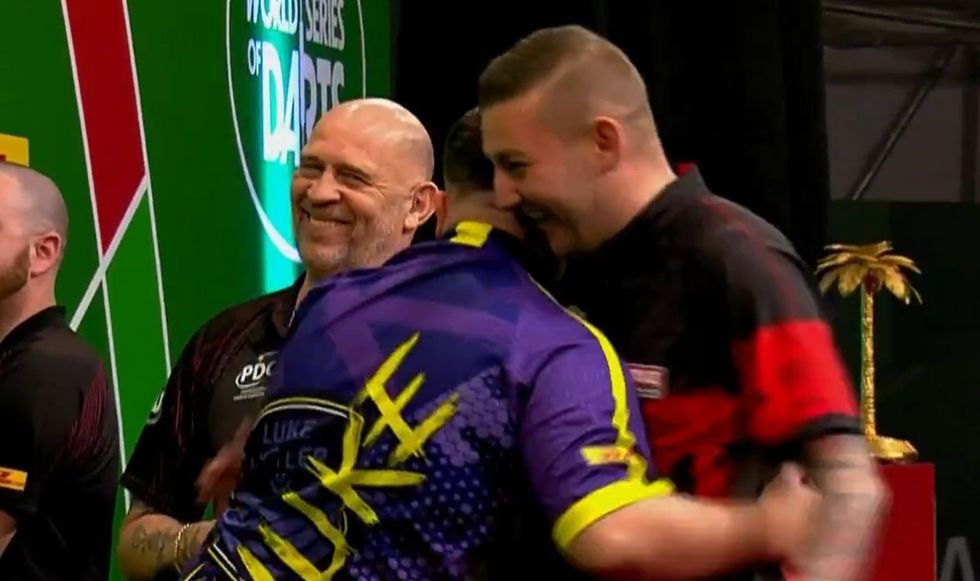Nathan Aspinall congratulated Luke Littler