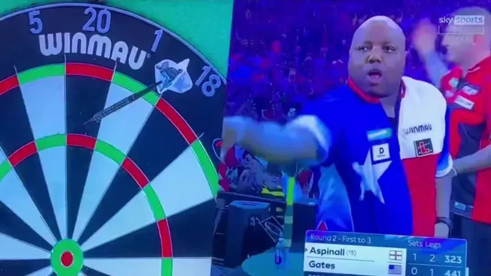 Nathan Aspinall was caught appearing to urge the Alexandra Palace crowd to continue their explicit chant directed at Prime Minister Sir Keir Starmer during the World Darts Championship
