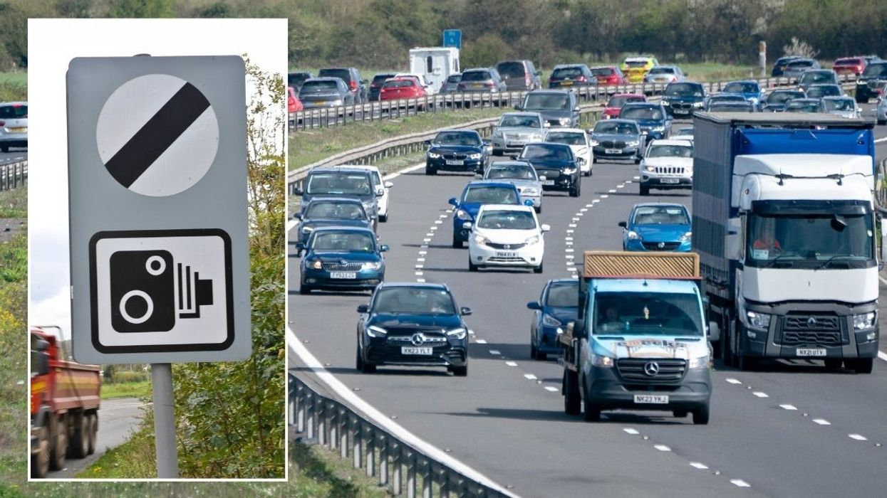 National speed limit sign and a busy motorway