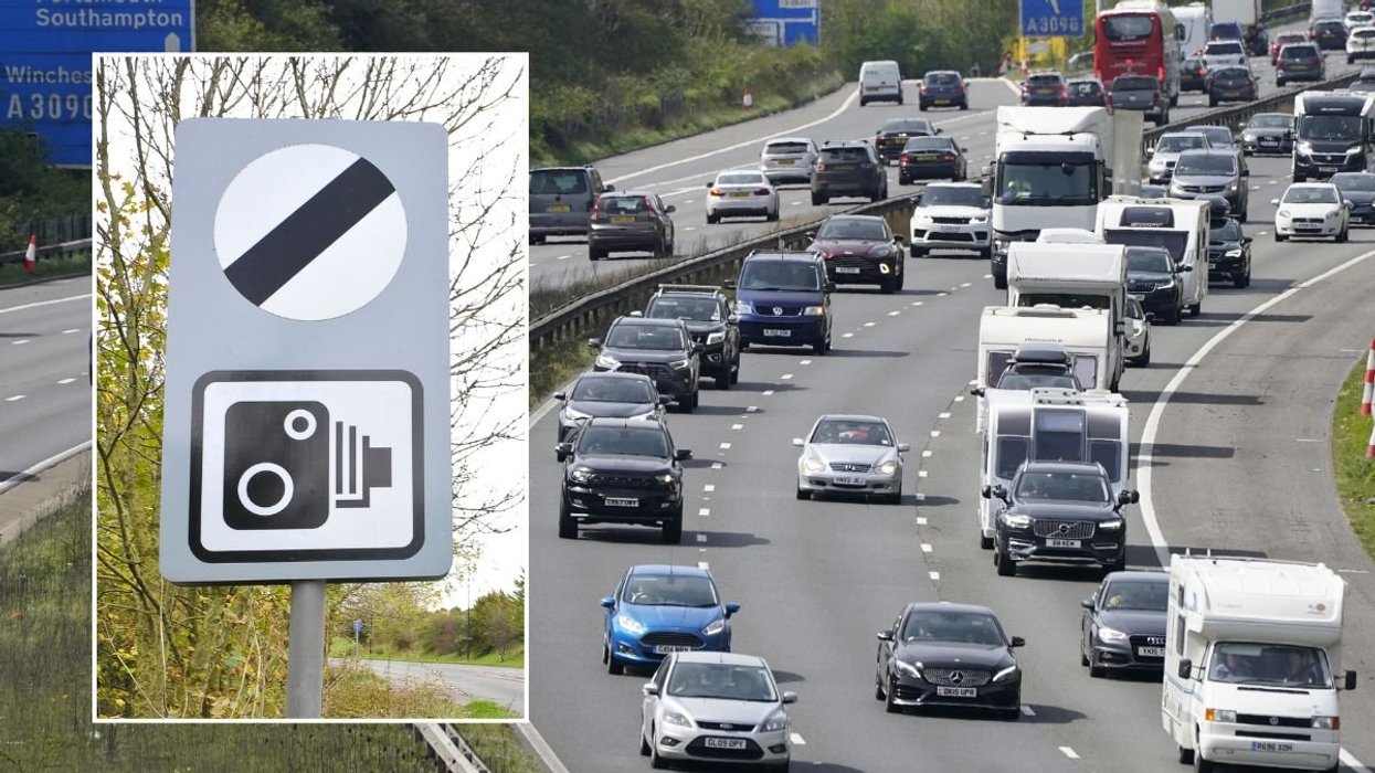 National speed limit sign and a busy motorway