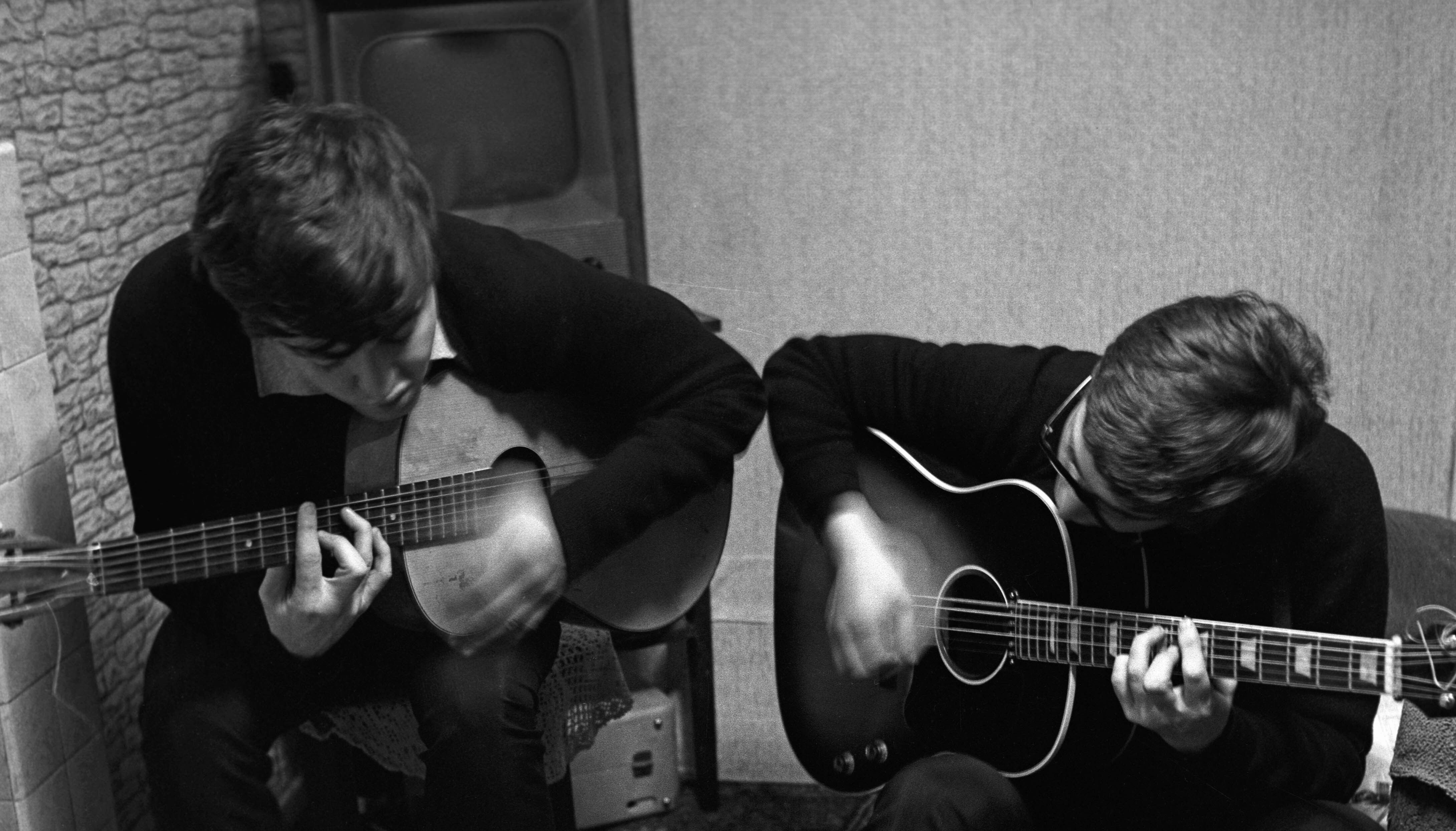 National Trust handout photo of Sir Paul McCartney and John Lennon writing I Saw Her Standing There in Sir Pauls childhood home on Forthlin Road in Allerton, Liverpool. Issue date: Tuesday April 5, 2022.