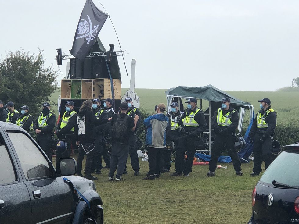 Nearly two dozen people have been arrested after police swooped on the rave taking place on the picturesque South Downs in breach of lockdown restrictions