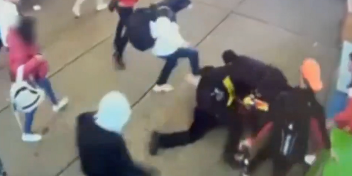 NextImg:New York police officers horrifically attacked by migrants in middle of Times Square