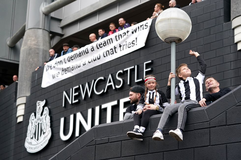 Newcastle United fans outside the stadium ahead of the Premier League match at St. James' Park, Newcastle. Picture date: Sunday October 17, 2021.