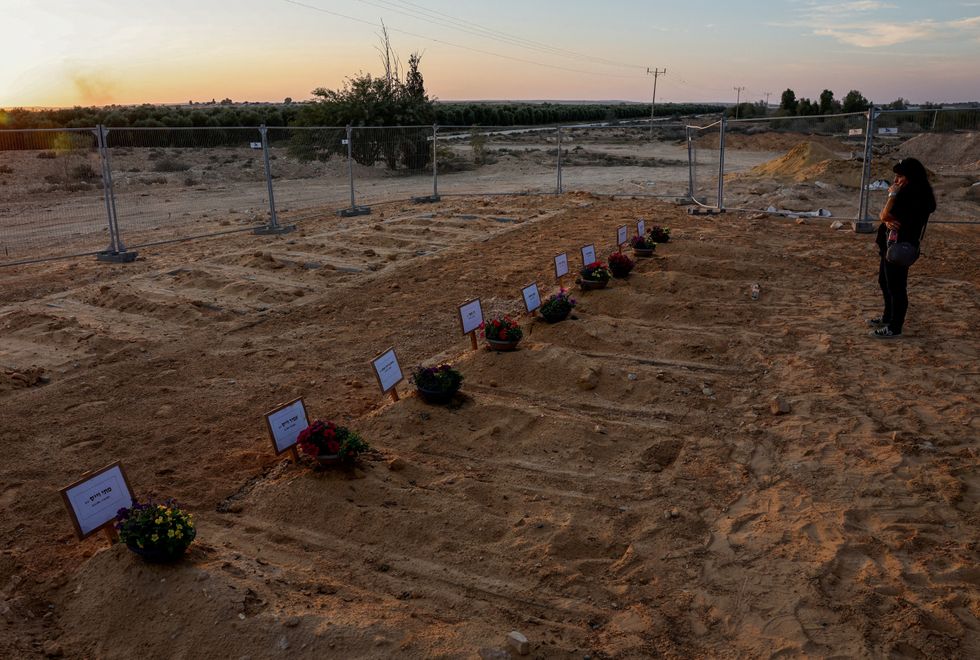 Newly dug graves for the victims of the October 7th attack