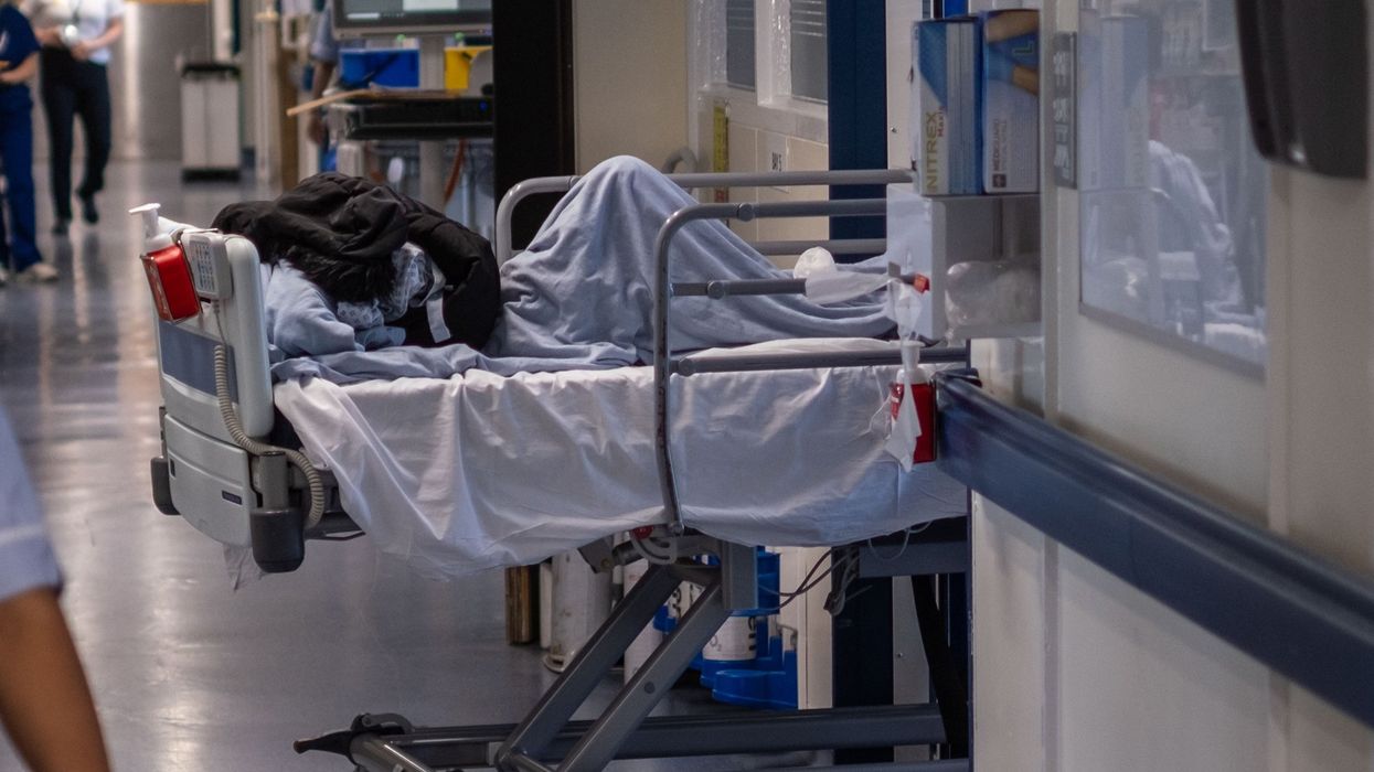 NHS patient being treated in a corridor