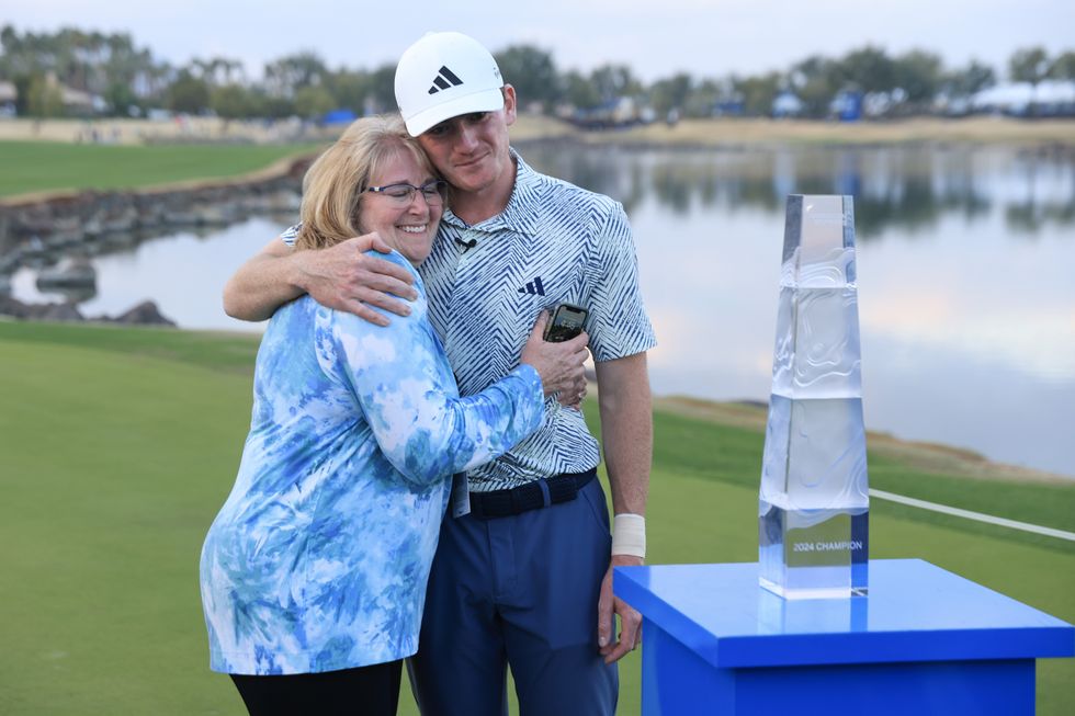 Nick Dunlap hugs his mother, Charlene, after his win