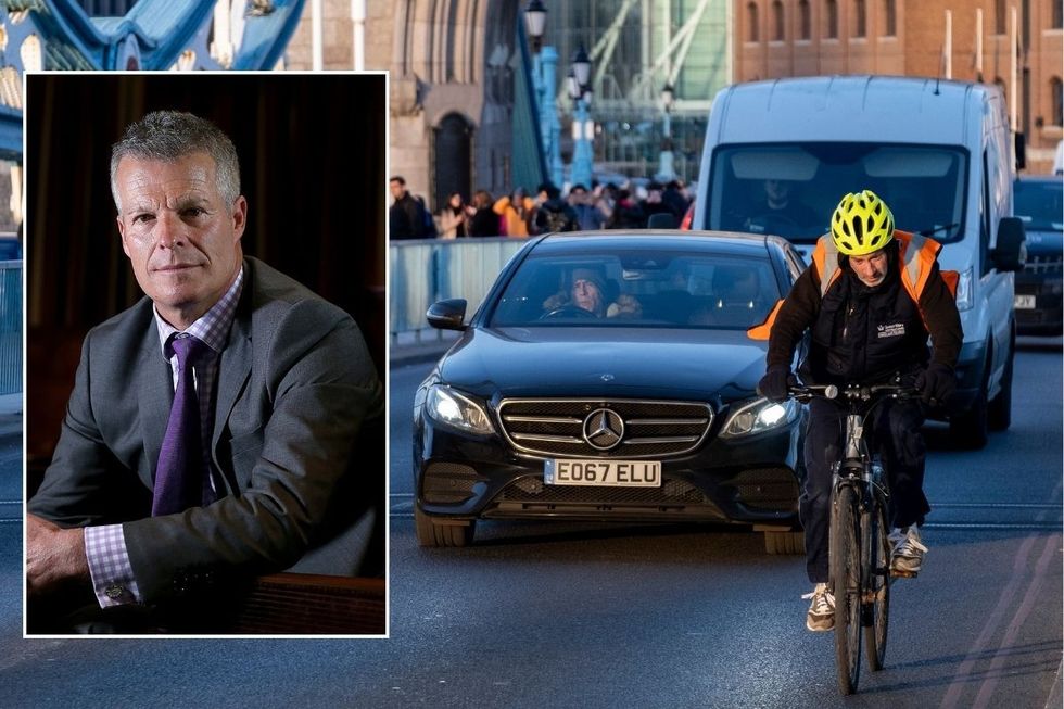 Nick Freeman and a cyclist riding in traffic