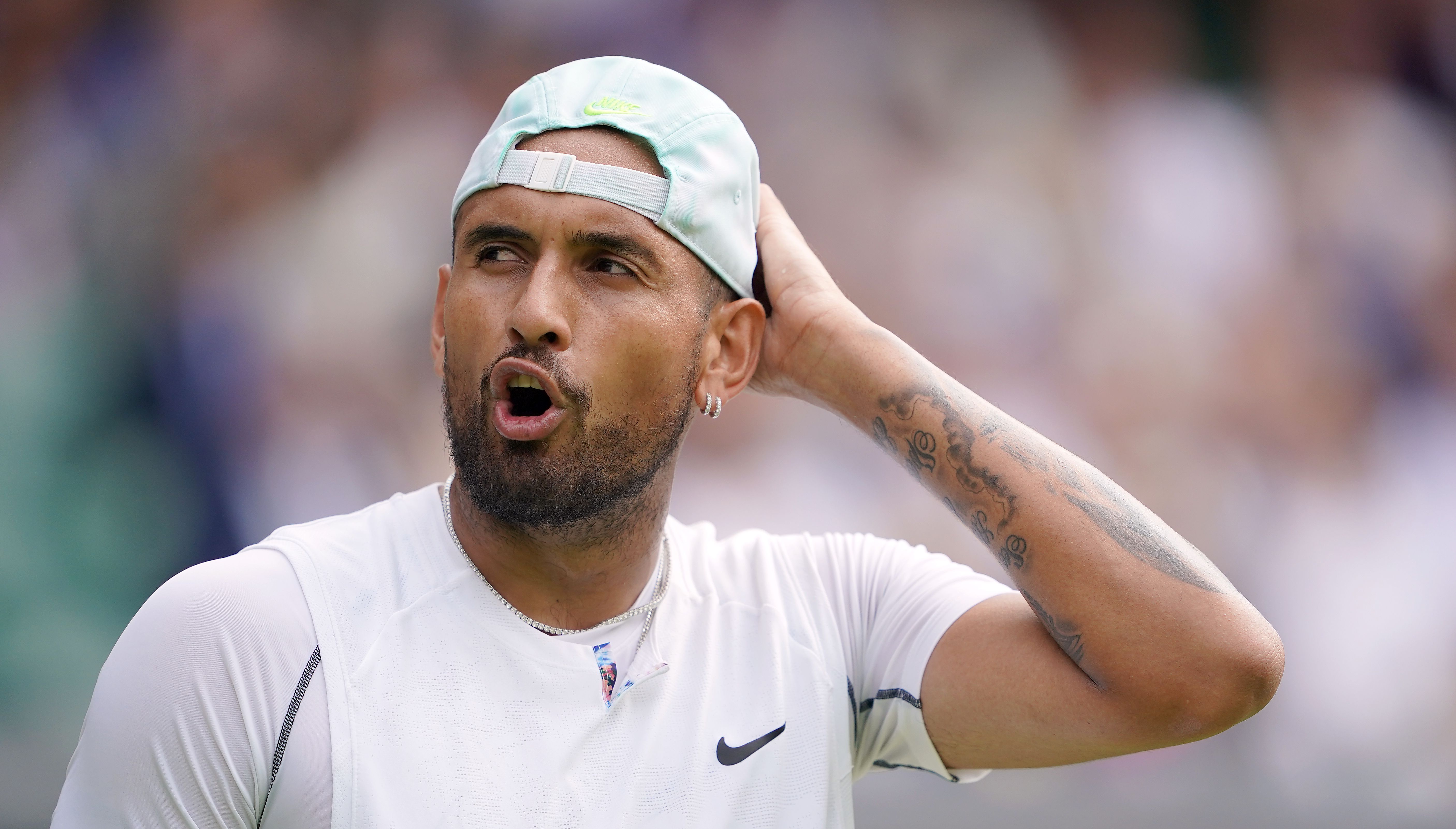 Nick Kyrgios reacts during his Gentlemen's singles fourth round match against Brandon Nakashima on day eight of the 2022 Wimbledon Championships at the All England Lawn Tennis and Croquet Club, Wimbledon. Picture date: Monday July 4, 2022.