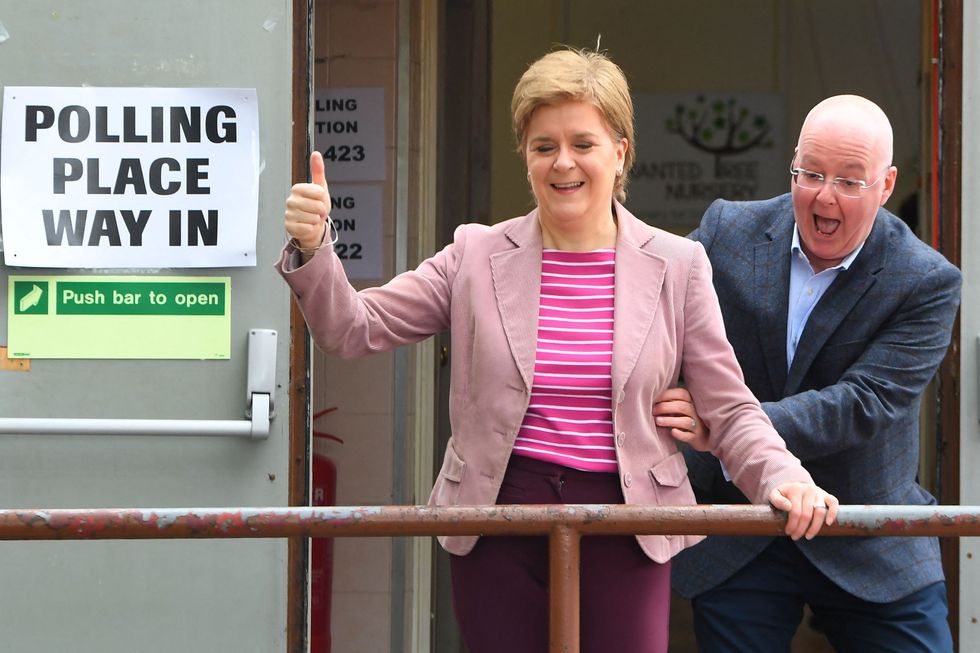nicola sturgeon and peter murrell and polling station