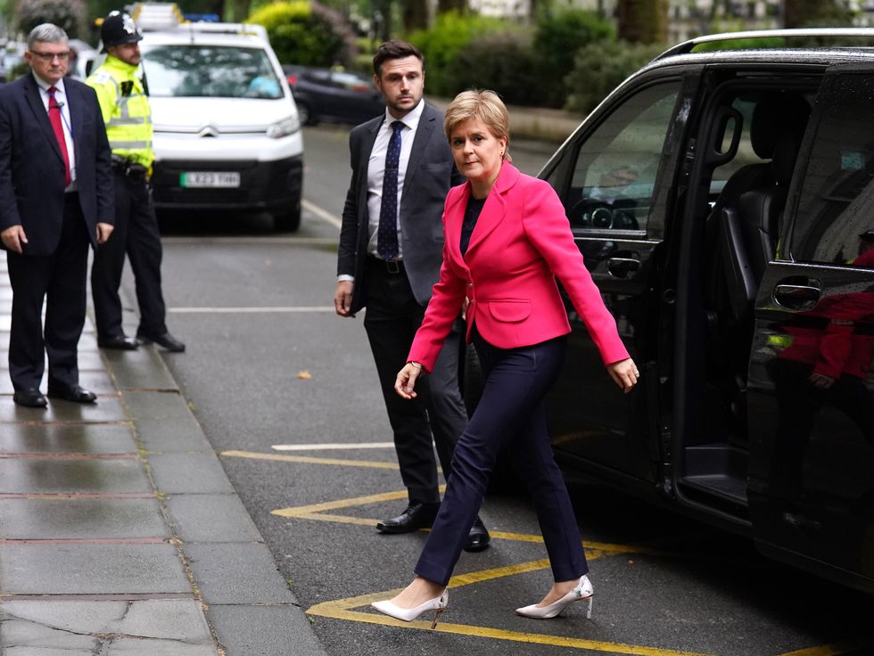 Nicola Sturgeon exiting a vehicle to arrive at the Covid Inquiry