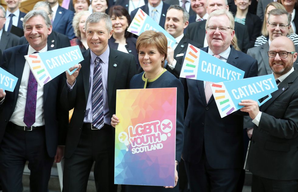 Nicola Sturgeon holding LGBT Youth Scotland