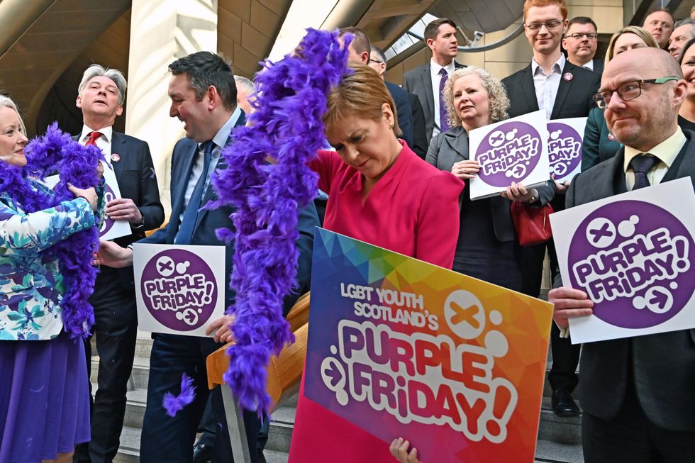 Nicola Sturgeon with LGBTYS placard