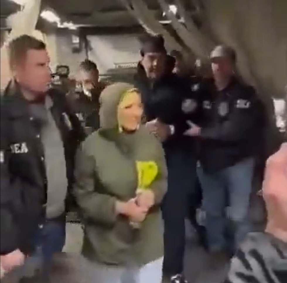 Nicolas Maduro and his wife Cilia Flores are led into the DEA