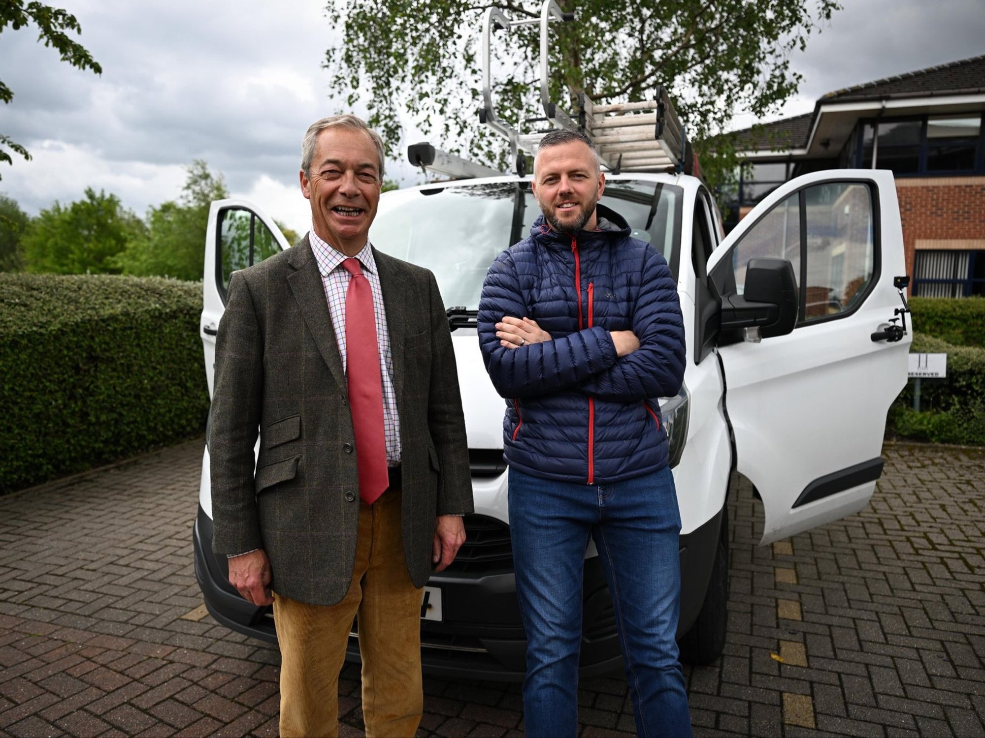 Nigel Farage and Reform UK's Rob Kenyon