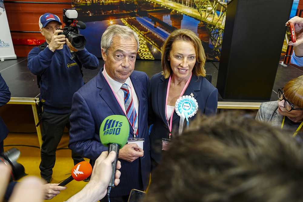 Nigel Farage and Sarah Pochin celebrate after she won the Runcorn & Helsby by-election on May 1, 2025
