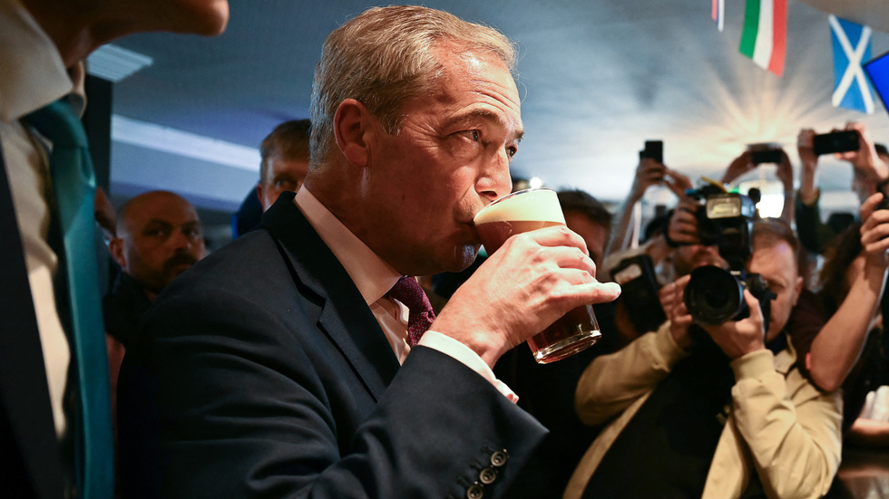 Nigel Farage drinking a pint