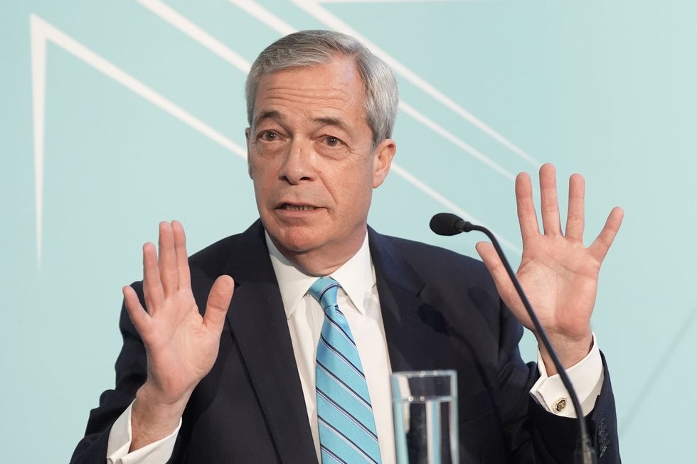 Nigel Farage holds a
