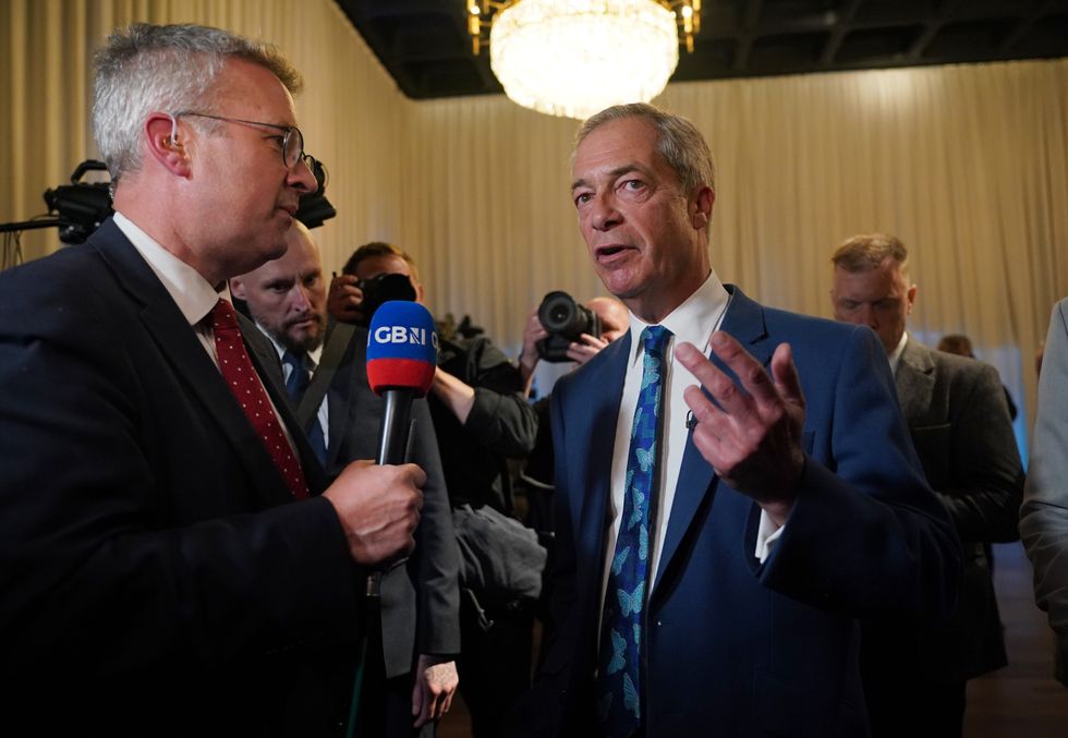 Nigel Farage is interviewed by GB News following the Reform UK press conference, at The Glaziers Hall in London