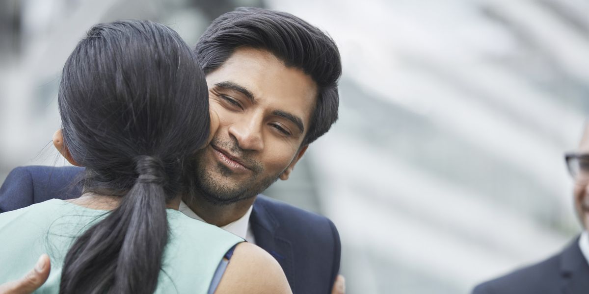 NextImg:Judge rules giving your colleague an 'air kiss' is NOT sexual harassment after woman sued her boss