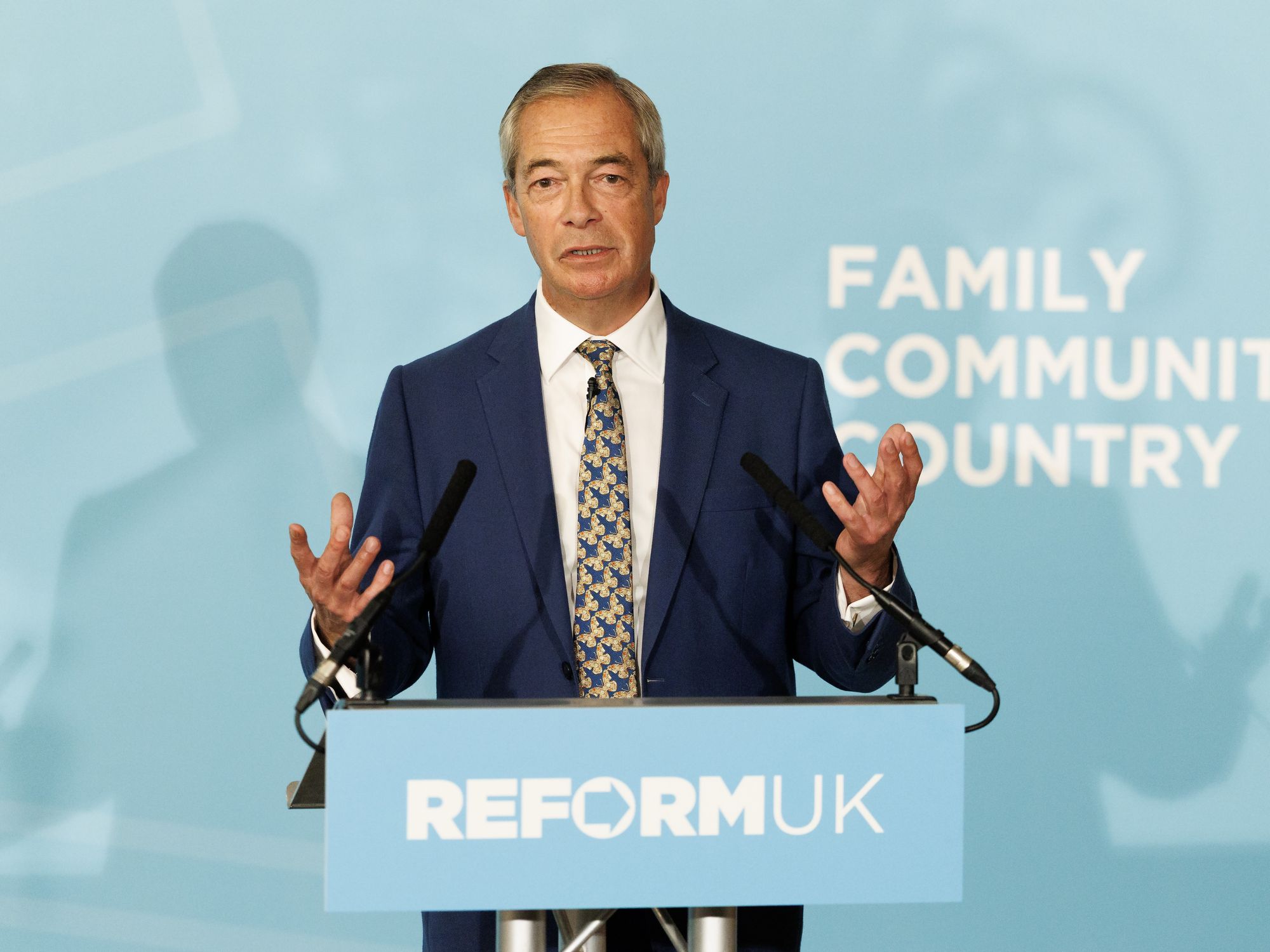 Nigel Farage speaking on stage