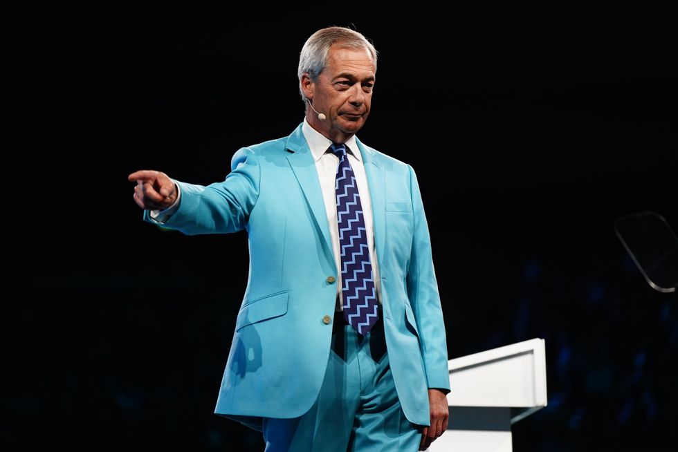 Nigel Farage speaking on the main stage at the Reform UK conference