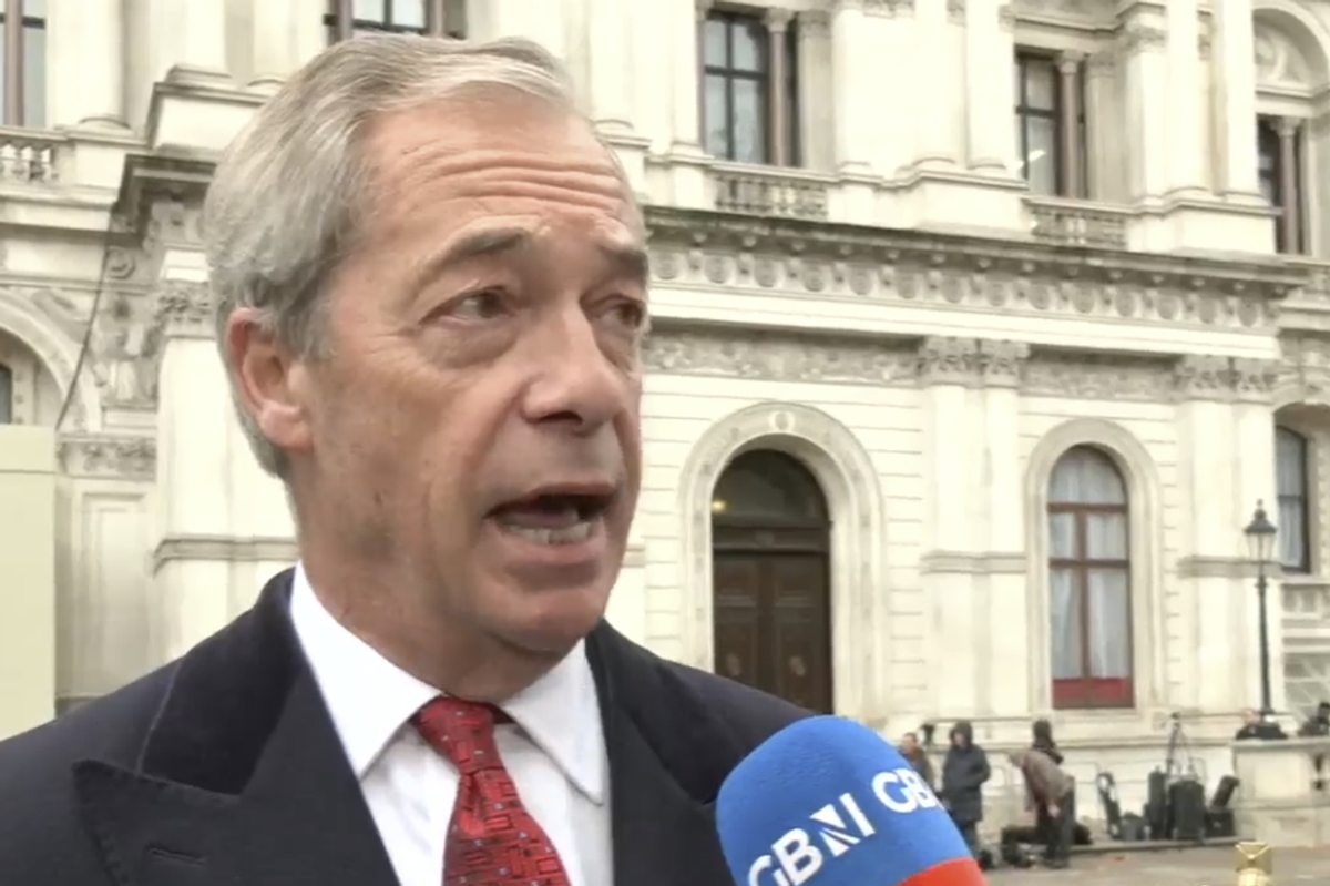 Nigel Farage speaking to Charlie Peters along Whitehall