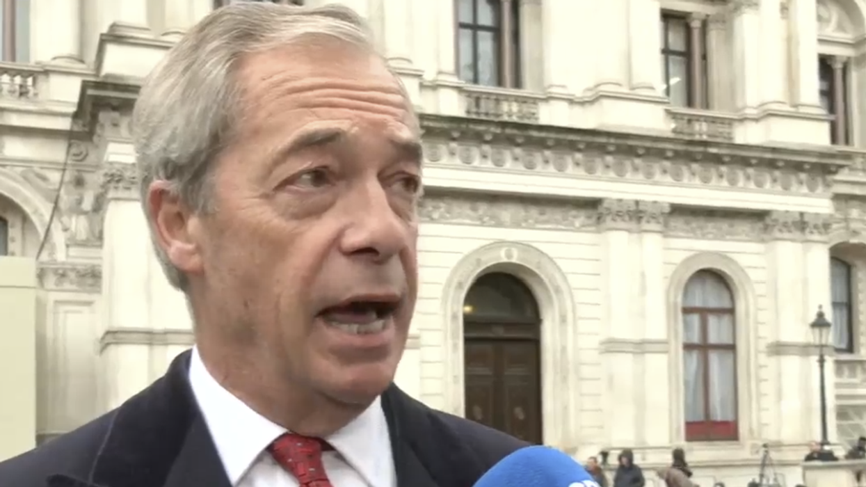 Nigel Farage speaking to Charlie Peters along Whitehall