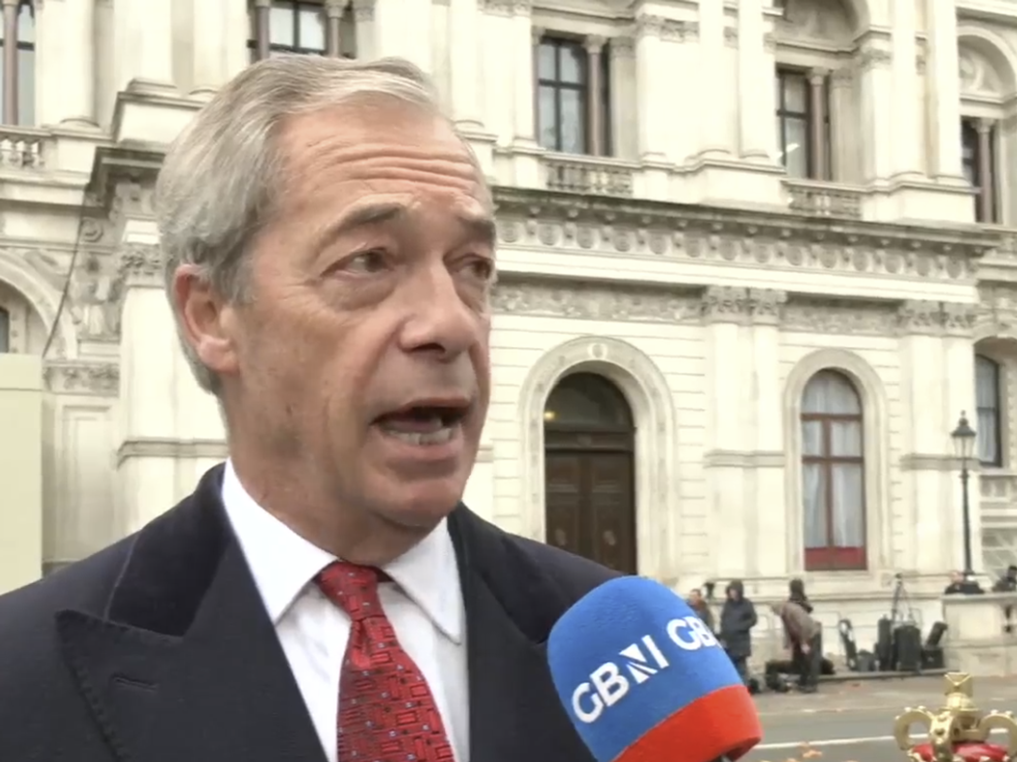 Nigel Farage speaking to Charlie Peters along Whitehall