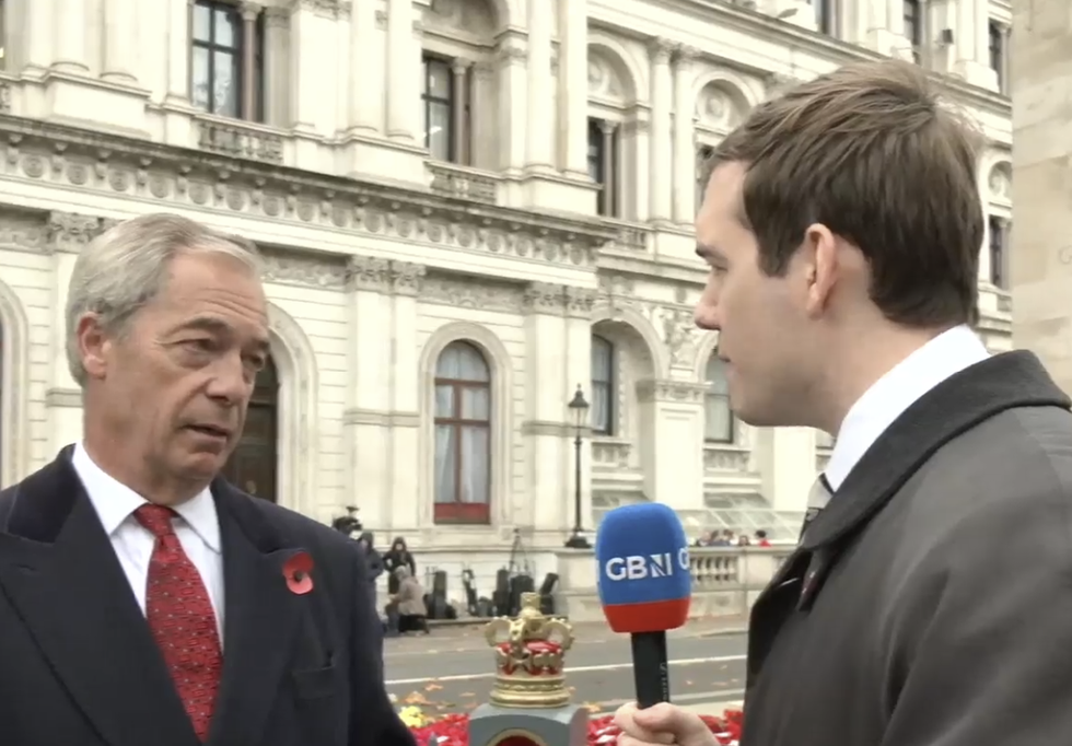 Nigel Farage speaking to Charlie Peters along Whitehall