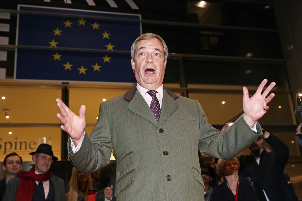 Nigel Farage speaks to the media as he leaves the European Parliament in Brussels, Belgium