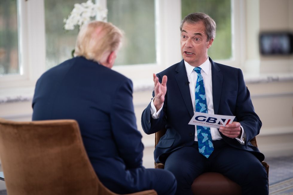 Nigel Farage talking to Donald Trump