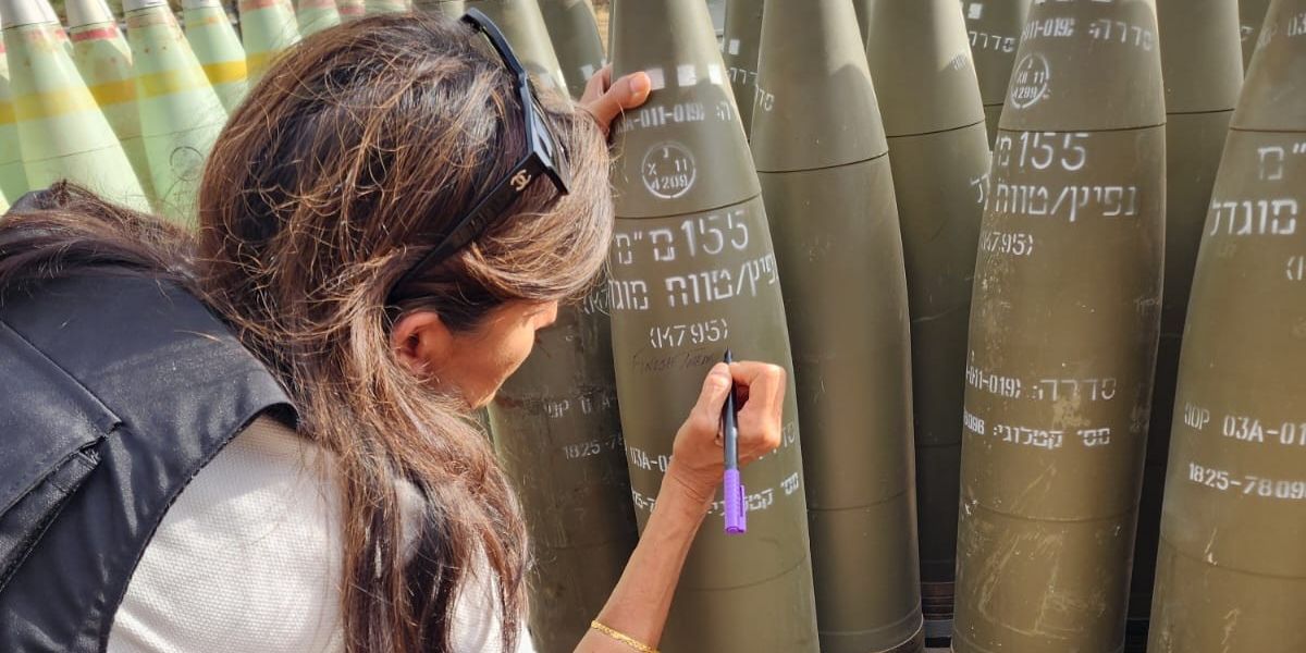NextImg:Nikki Haley sparks outrage after writing 'finish them' on IDF shells being fired into Rafah