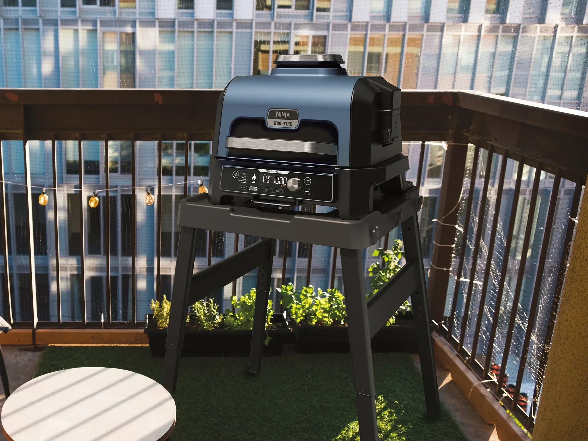 ninja woodfire bbq pictured on a stand on a balcony
