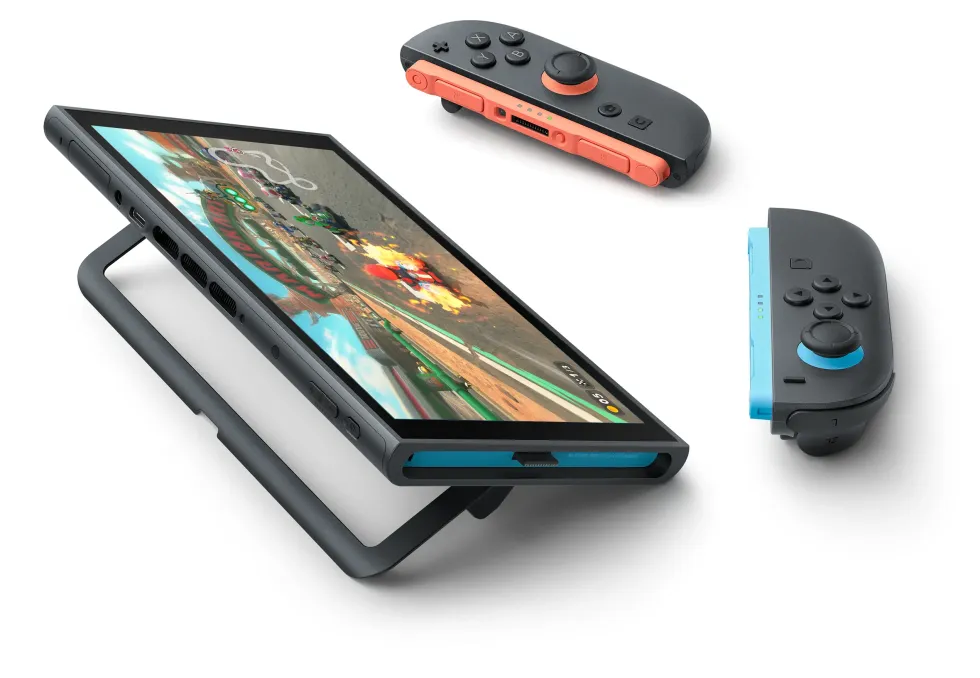 Nintendo Switch 2 console pictured in tabletop mode with the colourful Joy-Con 2 controllers resting on the table