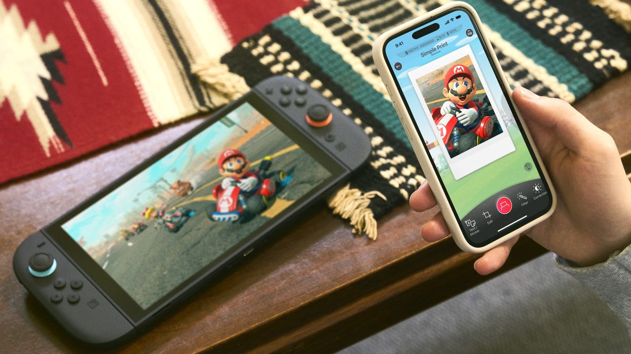 Nintendo Switch 2 console with Nintendo Switch app open on iPhone