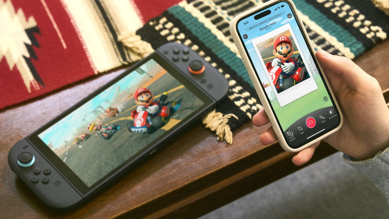 Nintendo Switch 2 console with Nintendo Switch app open on iPhone