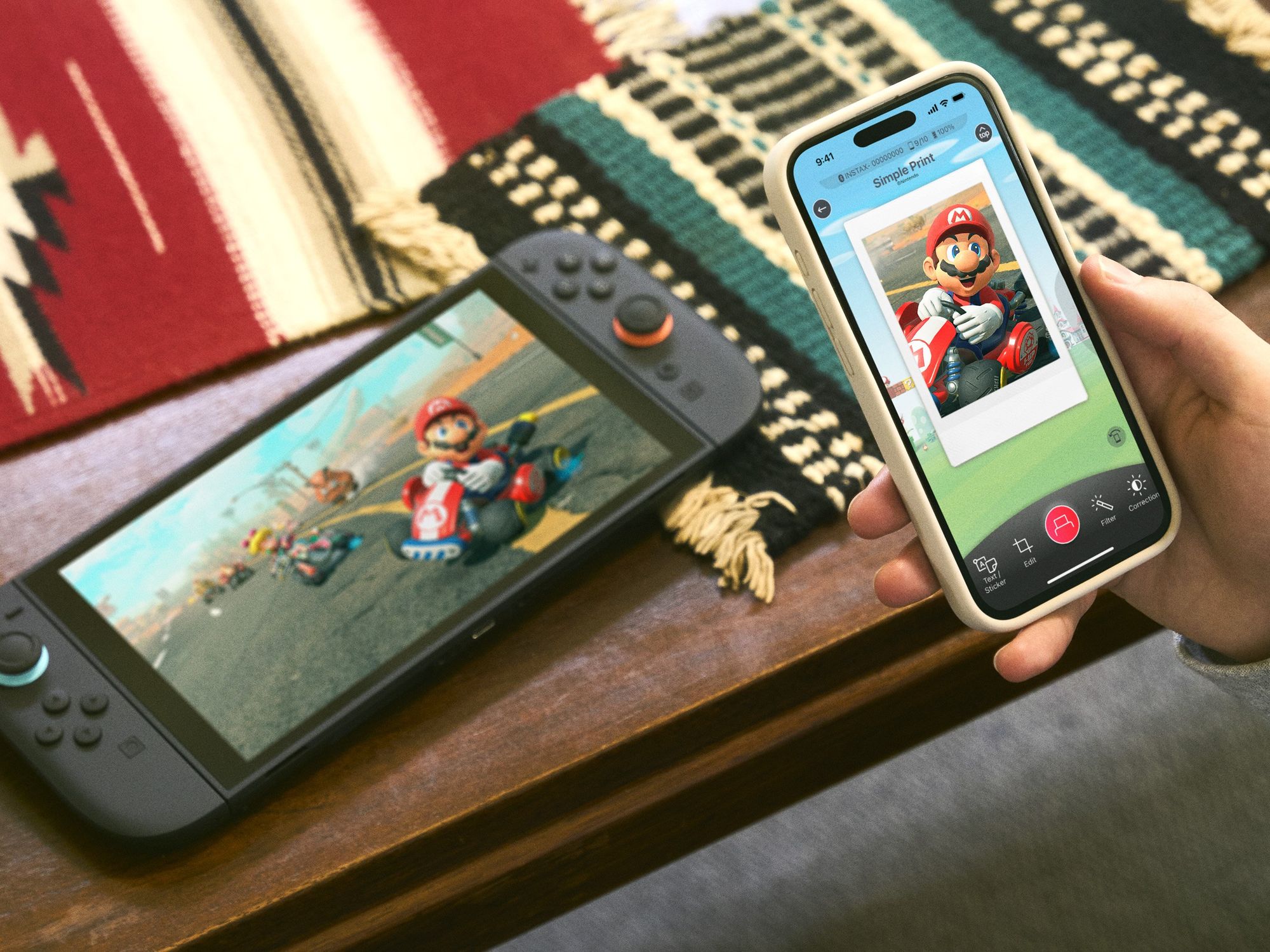 Nintendo Switch 2 console with Nintendo Switch app open on iPhone