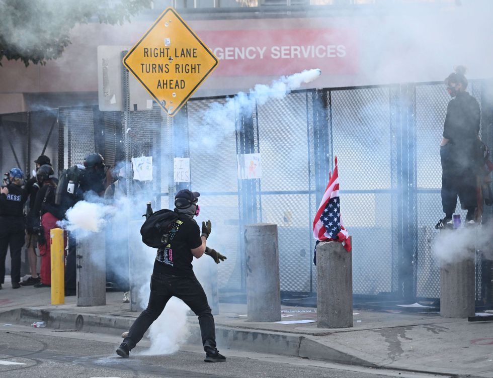 No Kings protester hurls projectile over fence of Government building