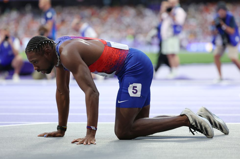 Noah Lyles appeared out of breath as he tried to get up