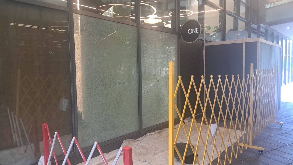 Palestine protesters smash glass windows of Barclays Bank and cover branch in red paint