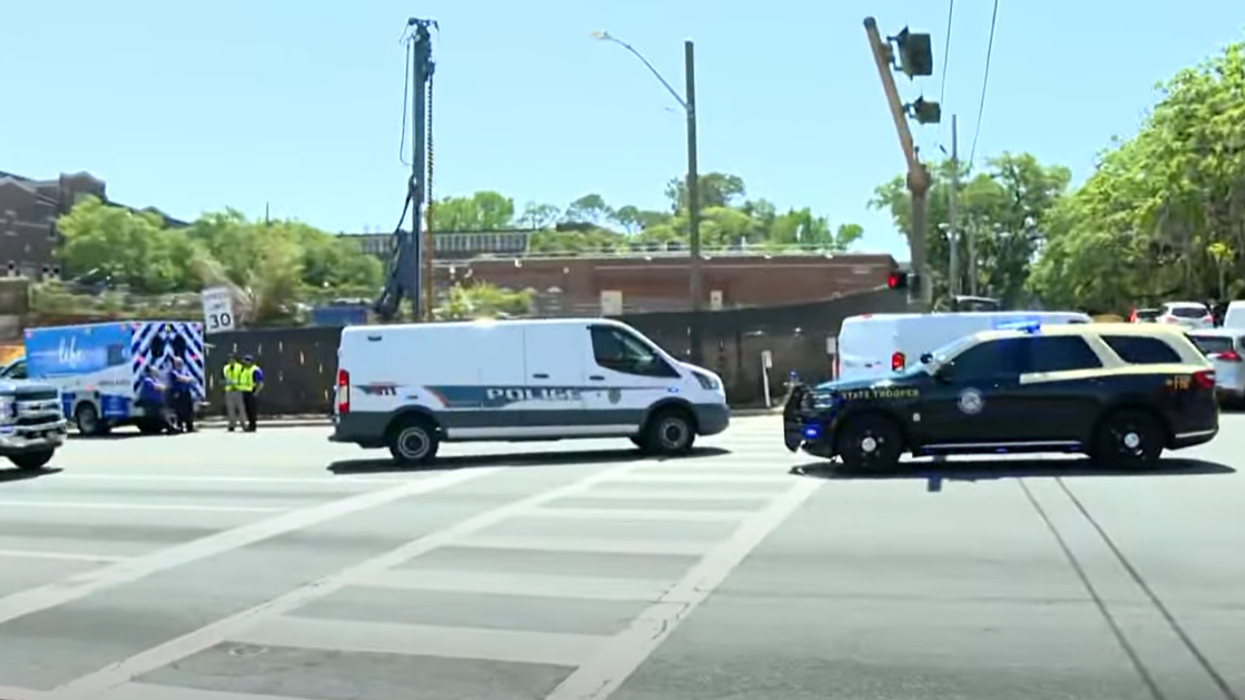 Gunman shoots two people dead as university forced into lockdown while students rush from scene