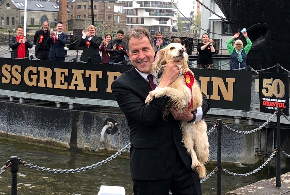 Norris celebrates with his dog