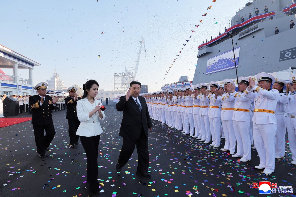 North Korean leader Kim Jong Un, accompanied by his daughter Kim Ju Ae, attends a ceremony for the launch of a "new multipurpose destroyer,