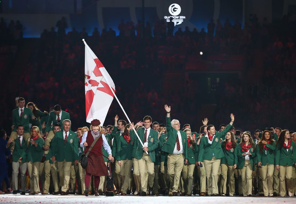 Northern Irish Commonwealth Games athletes stood with the Ulster Banner